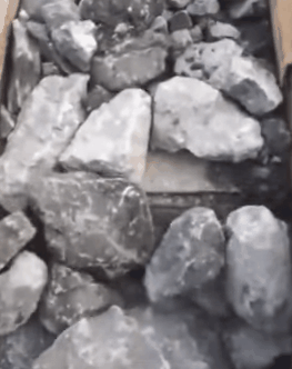 rock being crushed in jaw crusher
